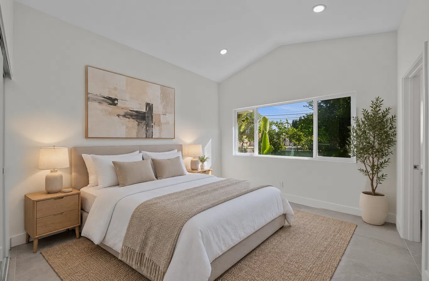 Bedroom with a sloped ceiling: empty → furnished